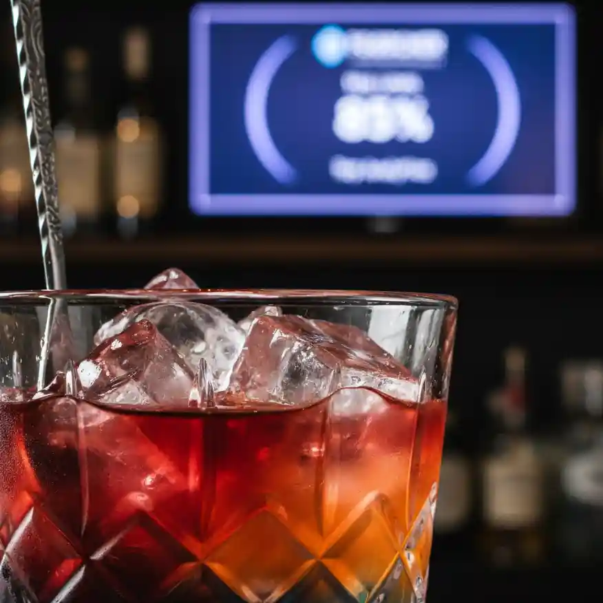 Expert cocktail preparation in a high-volume bar